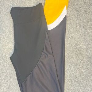 Nike Varsity Leggings in Black and Yellow